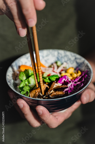 Thai salad on a bowl with chopsticks
