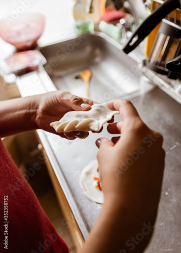 Hands making argentinian food photo