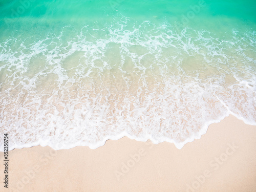 Sand beach with white sea soft wave on top view for assembling an article about travel in summer holiday or ocean coast nature. © wing-wing