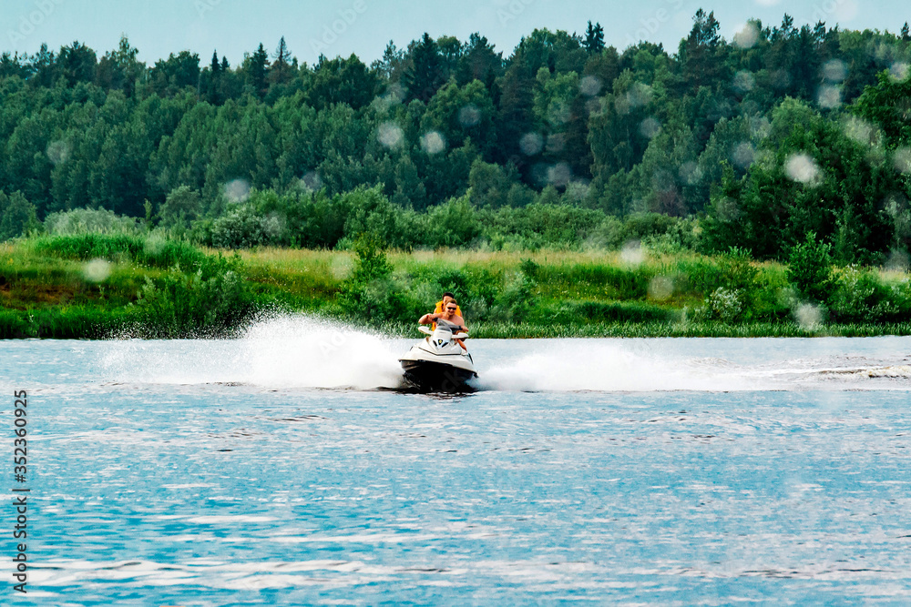 Fototapeta premium Couple rides a jet ski