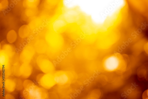 golden blur abstract background. yellow bokeh christmas blurred beautiful shiny Christmas lights © ooddysmile