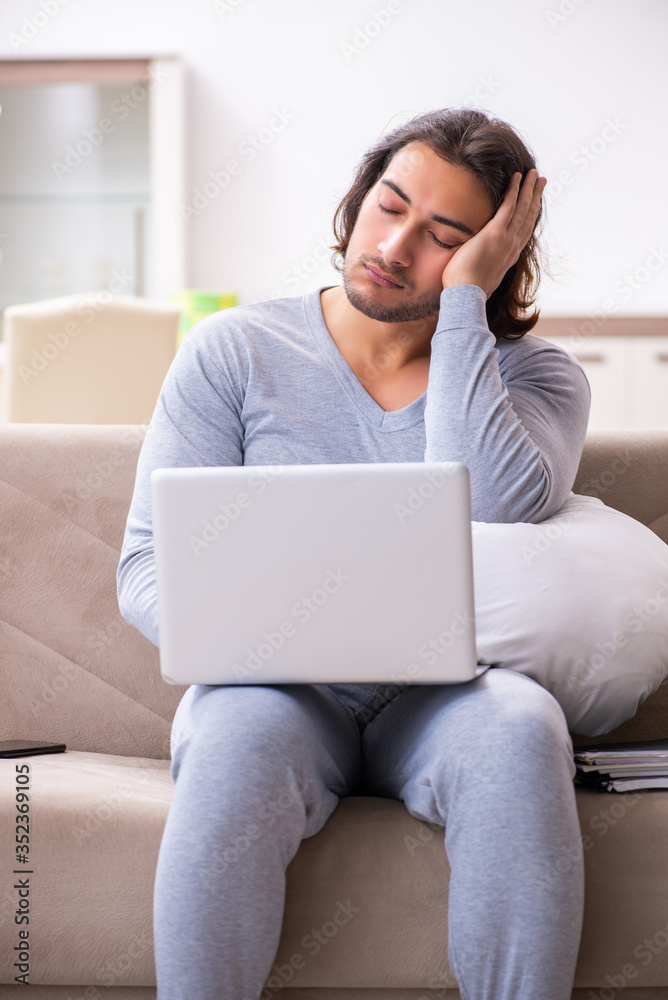 Young male employee freelancer working from home Young male employee freelancer working from home