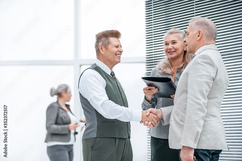 close up. Manager and customer shaking hands