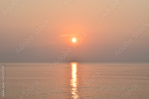 sunrise above the sea. This image is orange © juthamas