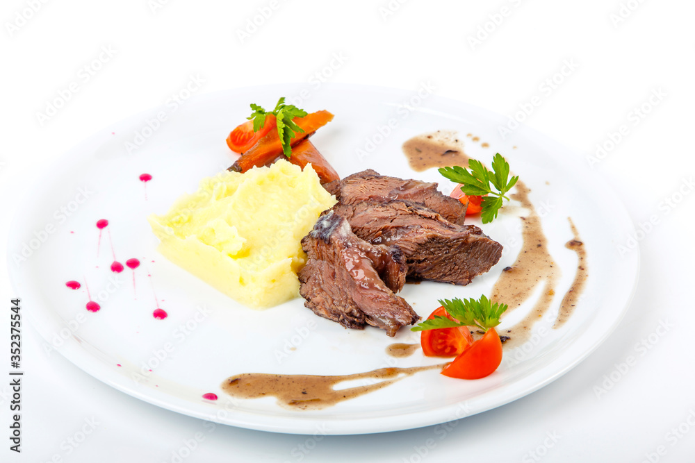 Beef cheeks with mashed potatoes. On white background