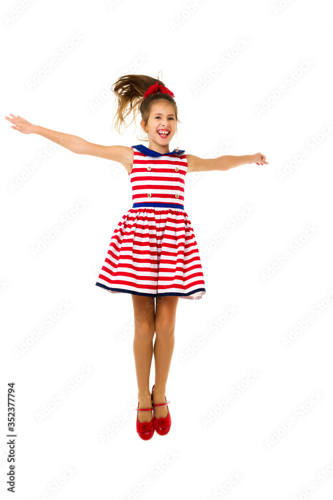 Little girl is jumping.The concept of a happy childhood, outdoor Little girl is jumping.The concept of a happy childhood, outdoor