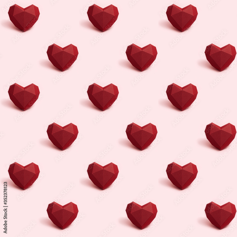 Seamless pattern with dark red polygonal paper heart on pink background. Wallpaper for Valentines Day. Love concept. Bright colors. Minimal style.