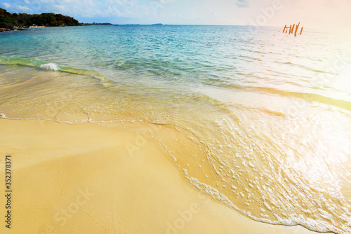Sea waves on sand beach water and coast seascape - View of beautiful tropical landscape beach sea island with ocean blue sky and resort background in Thailand summer beach vacation