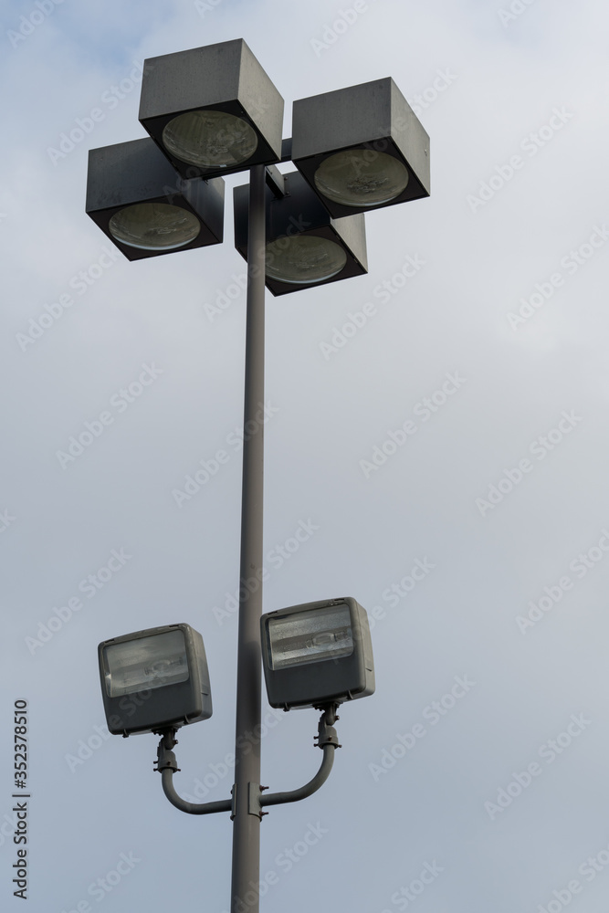 Supermarket parking street lighting lamps on a spring evening. Supermarket parking street lighting lamps on a spring evening.