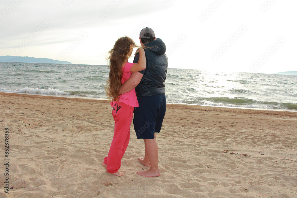 man and woman on a sandy beach man and woman on a sandy beach
