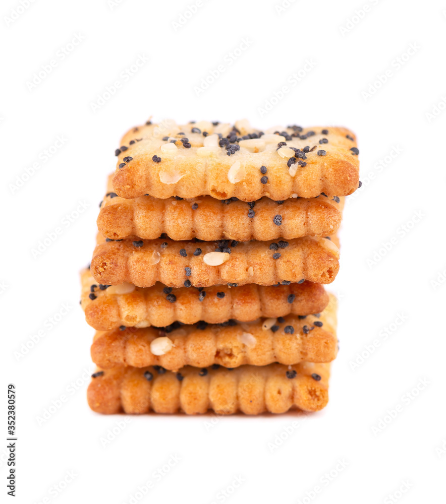 Square poppy seeds and sesame crackers isolated on white background. Dry cracker cookies isolated. Salty snacks isolated. Square poppy seeds and sesame crackers isolated on white background. Dry cracker cookies isolated. Salty snacks isolated.