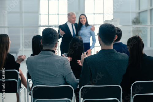 boss and business team congratulating the best employee with applause.