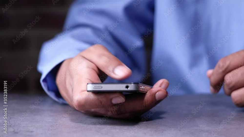 Close up of a man using mobile smart phone. Close up of a man using mobile smart phone.