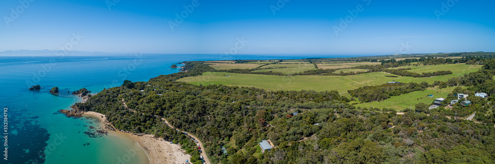 Aerial panoramic landscape of ocean and farmlands in Australia