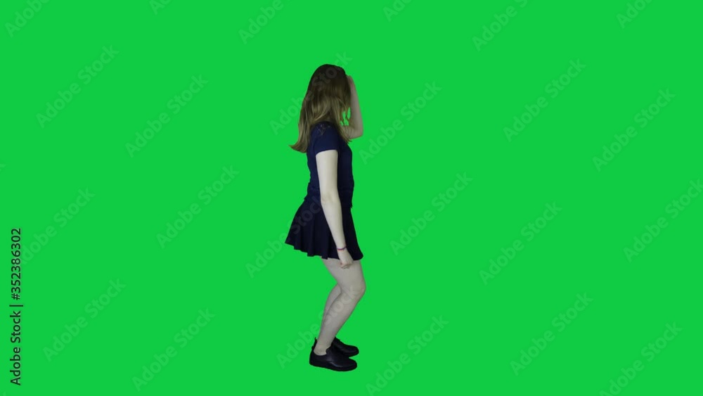 A beautiful female dancing in front of a green screen A beautiful female dancing in front of a green screen