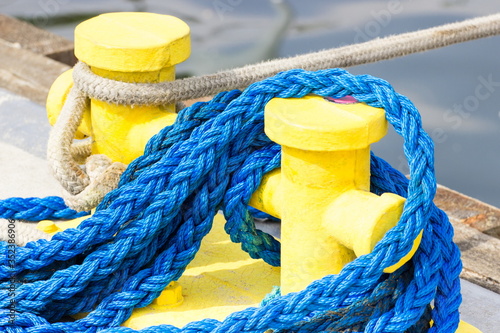 Tela Blue rope and mooring bollard, detail of seaport, yachting concept