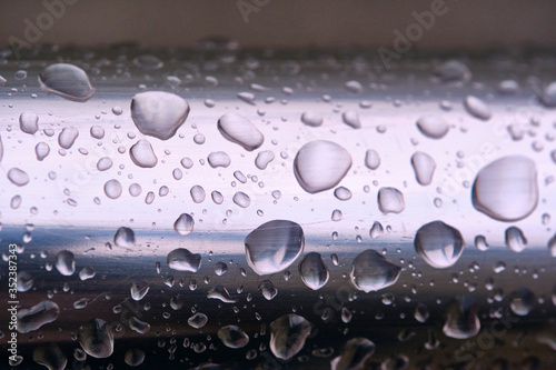 drops of water on the iron pipe macro color