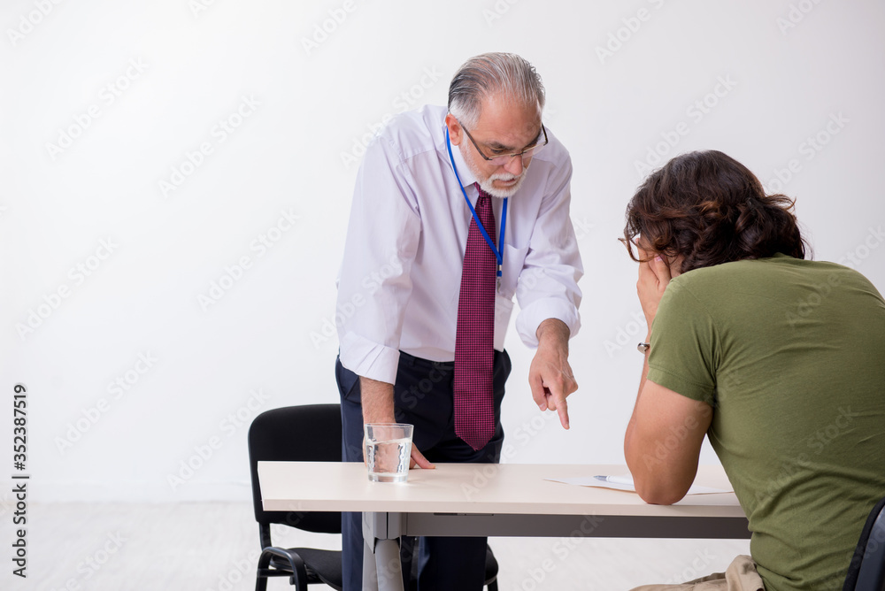 Young man meeting with advocate in pre-trial detention