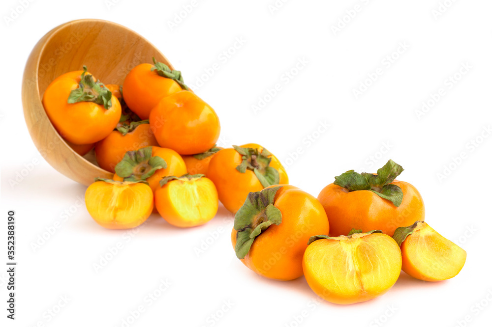 Closeup fresh orange organic ripe Fuyu Persimmons or Persimon fruits with sliced isolated on white background. Closeup fresh orange organic ripe Fuyu Persimmons or Persimon fruits with sliced isolated on white background.