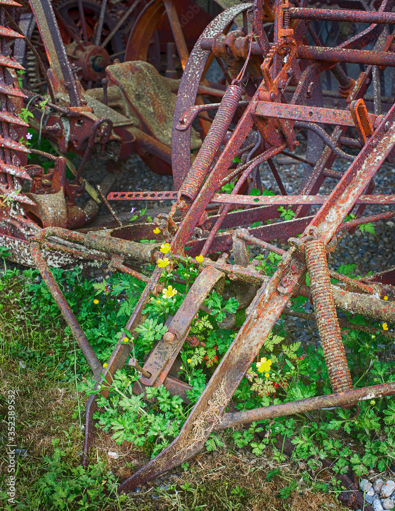 Abandoned vintage farm machinery lays forgotten