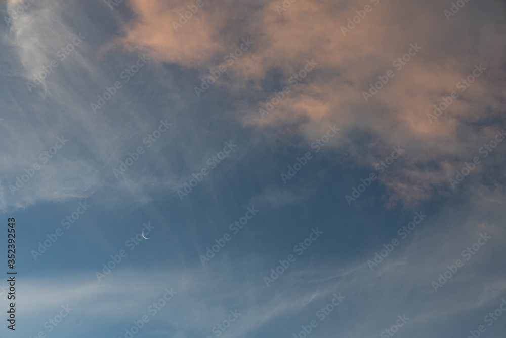 Moon and clouds during sunset coastal Moon and clouds during sunset coastal