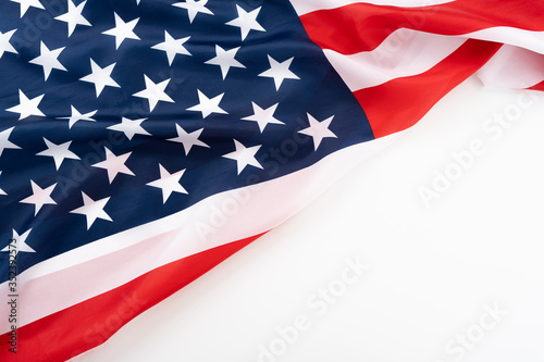 US American flag on white background. For USA Memorial day, Presidents day, Veterans day, Labor day, Independence or 4th of July celebration. Top view, copy space for text.