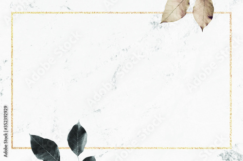 Gold frame with foliage pattern on marble textured background vector