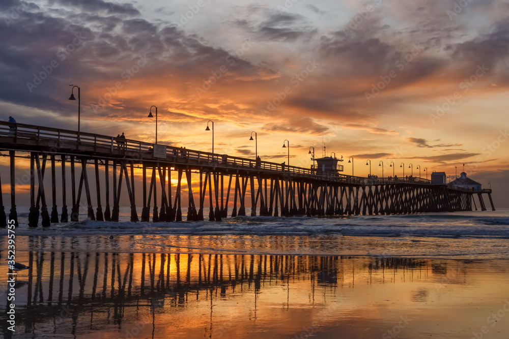 Brilliant sunset over a wooden beach pier. Imperial Beach, California, United states of America