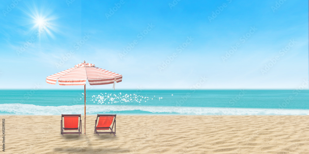 Obraz premium Summer Vacation and Holiday Trip Concept : Beach chair and umbrella on sand beach with beautiful seascape view of sea and blue sky in the background.