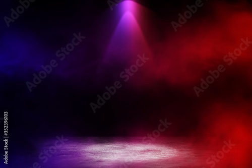 Empty space of Studio dark room with white fog and lighting effect red and blue on concrete floor gradient background for interior decoration.