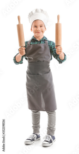 Portrait of little chef on white background