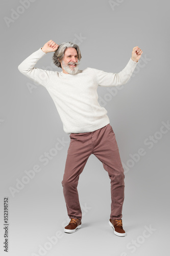 Cool senior man dancing aga...