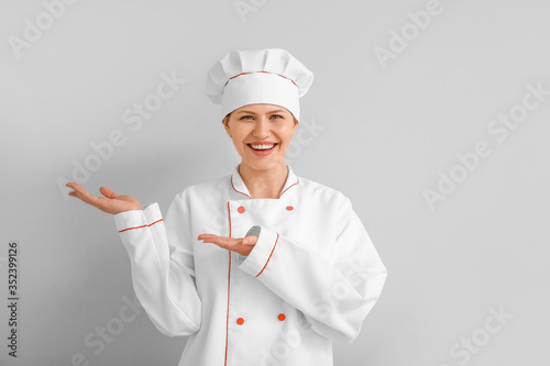 Beautiful female chef on li...