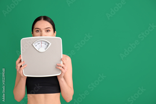 Young woman with measuring ...