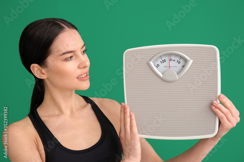Young woman with measuring ...