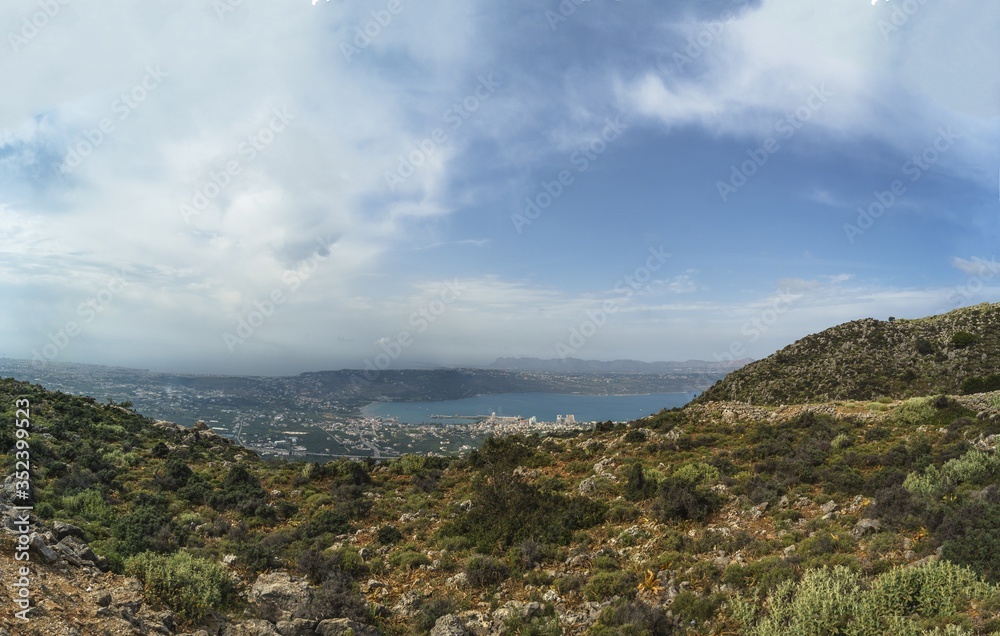 Panorama of the city on the sea coast in the valley