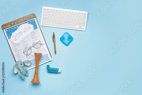 Laboratory test form, computer keyboard and toy on color background. Concept of coronavirus epidemic