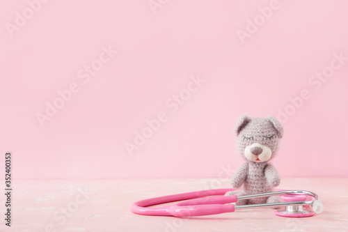 Toy with stethoscope on col...