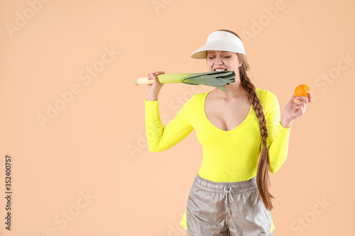 Young woman with leek and t...