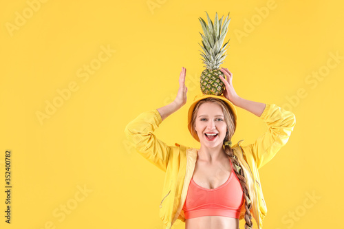 Young woman with pineapple ...