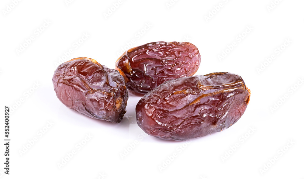 Medjool dried date palm fruits isolated on a white background. Medjool dried date palm fruits isolated on a white background.