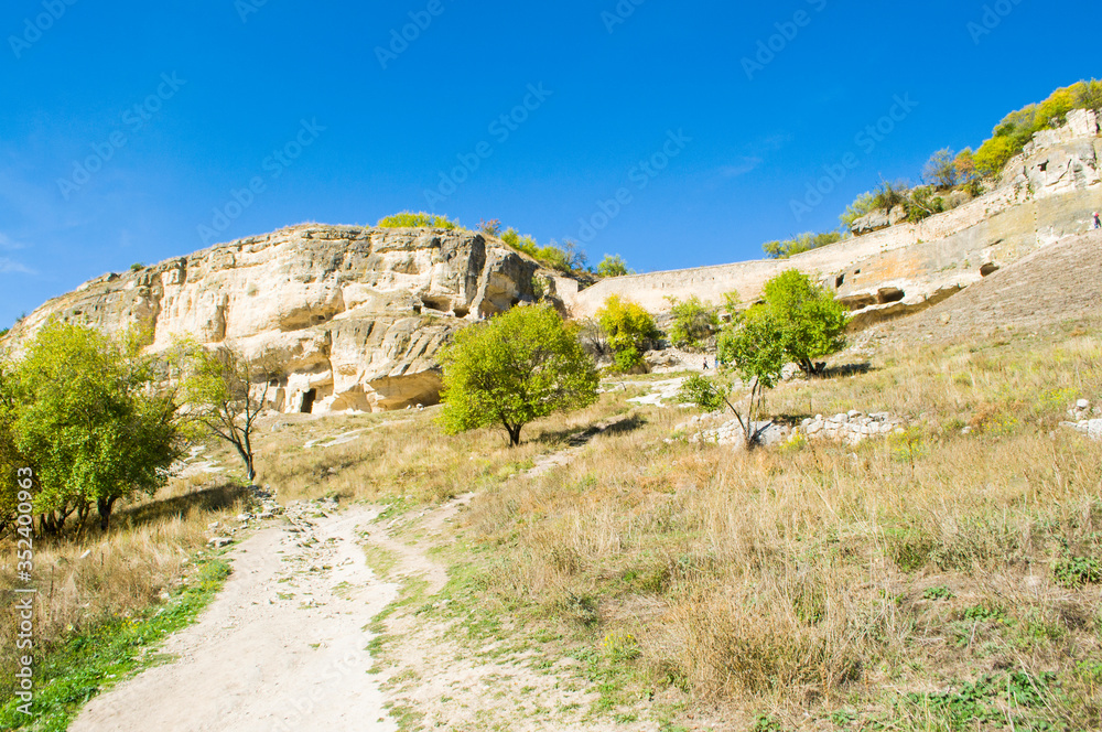 Panoramic view of mountains and valley covered with green forest. Beautiful mountain landscape.