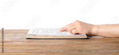 Woman reading Bible at table
