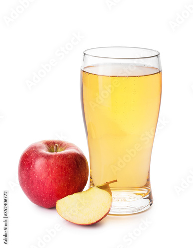Glass of apple cider on white background