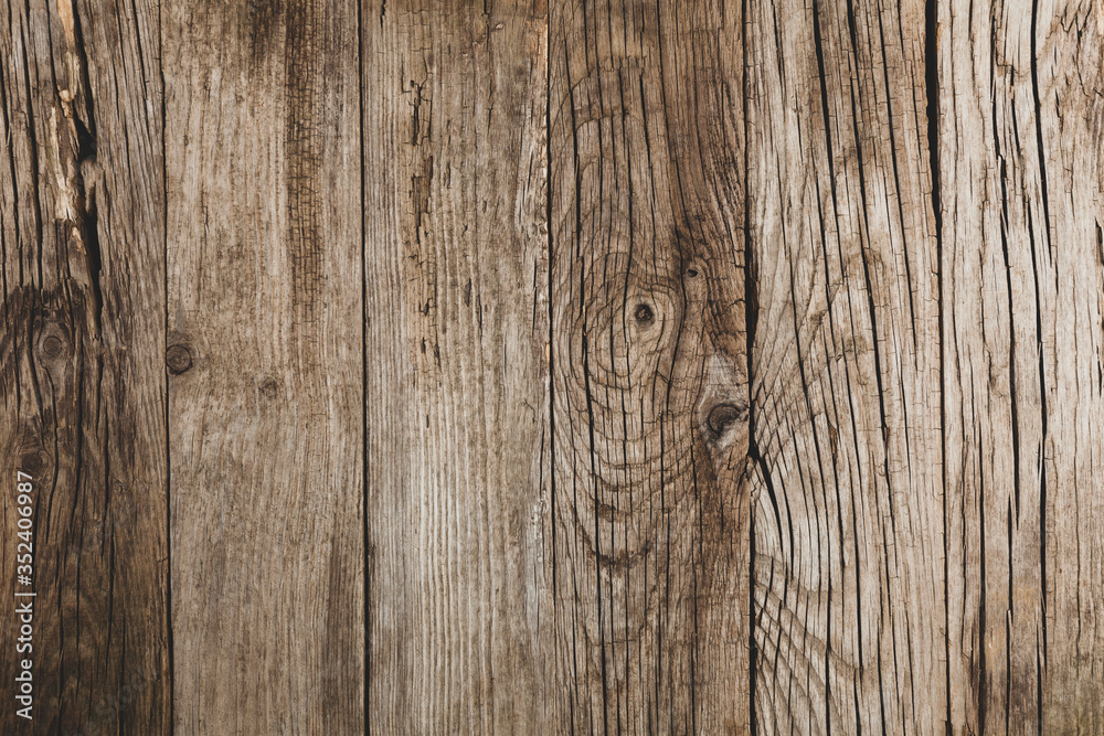 Old wooden table with cracks and scratches, aged rustic background. Old wooden table with cracks and scratches, aged rustic background.