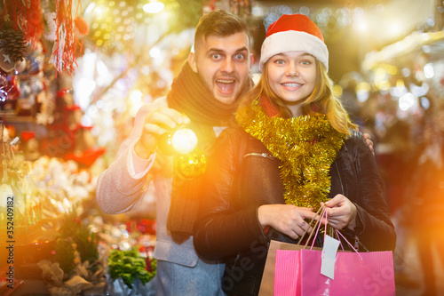 Couple in Christmas hat happinnes from buying decoration photo