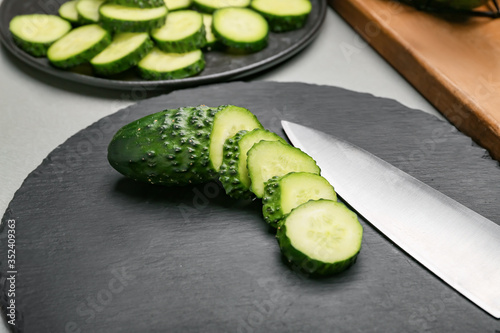Fresh cut cucumber on table