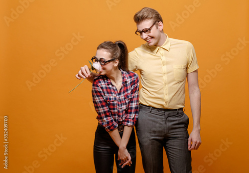 funny students in love on a yellow background