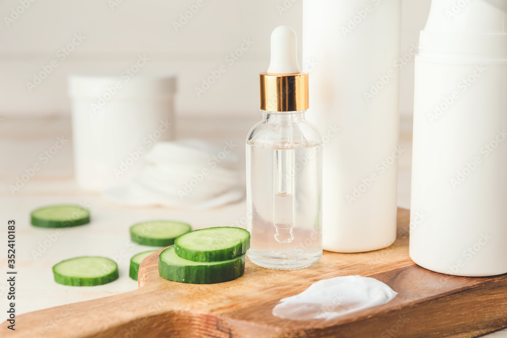 Cosmetics with cucumber extract on table Cosmetics with cucumber extract on table