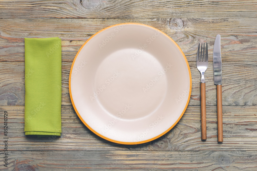 Simple table setting on wooden background